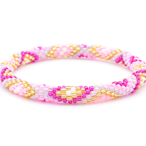 Sashka Co. handmade beaded friendship bracelet with pink, fuchsia, champagne gold, purple, and white glass beads. Crafted in Nepal by skilled artisans in a diamond pattern.