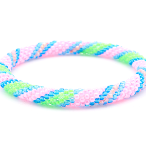 Sashka Co. Pink, Green, Blue Bracelet. Handmade glass bead bracelet from Nepal, featuring a roll design.
 