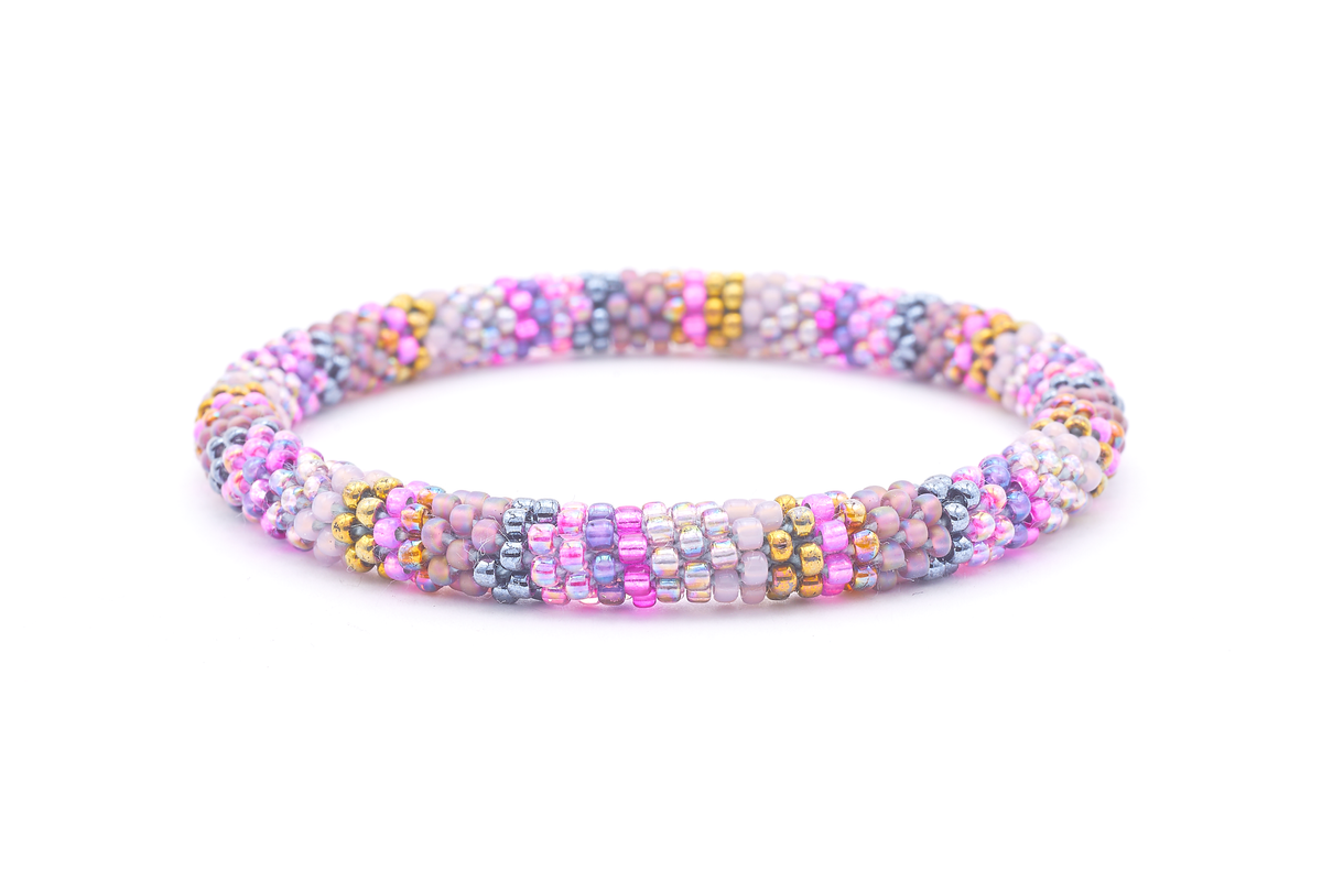 Sashka Co. handmade glass beaded friendship bracelet with pinks, purples, mauves, iridescents, and silvers glass beads. Crafted in Nepal by skilled artisans.