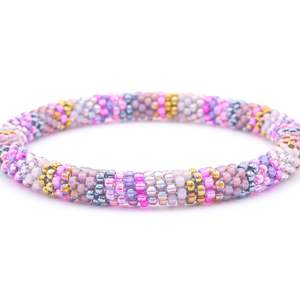 Sashka Co. handmade glass beaded friendship bracelet with pinks, purples, mauves, iridescents, and silvers glass beads. Crafted in Nepal by skilled artisans.