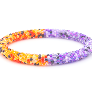 Sashka Co. handmade beaded friendship bracelet with purple, orange, and black glass beads. Crafted in Nepal by skilled artisans in a half-and-half confetti pattern.