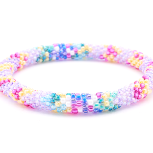 Handmade beaded friendship bracelet with purple, pink, blue, yellow, and teal glass beads. Crafted by artisans in Nepal for Sashka Co.