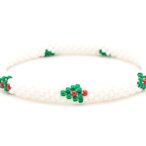 Sashka Co. handmade glass beaded friendship bracelet with red, white, and green glass beads in a festive holiday pattern. Crafted in Nepal by skilled artisans.