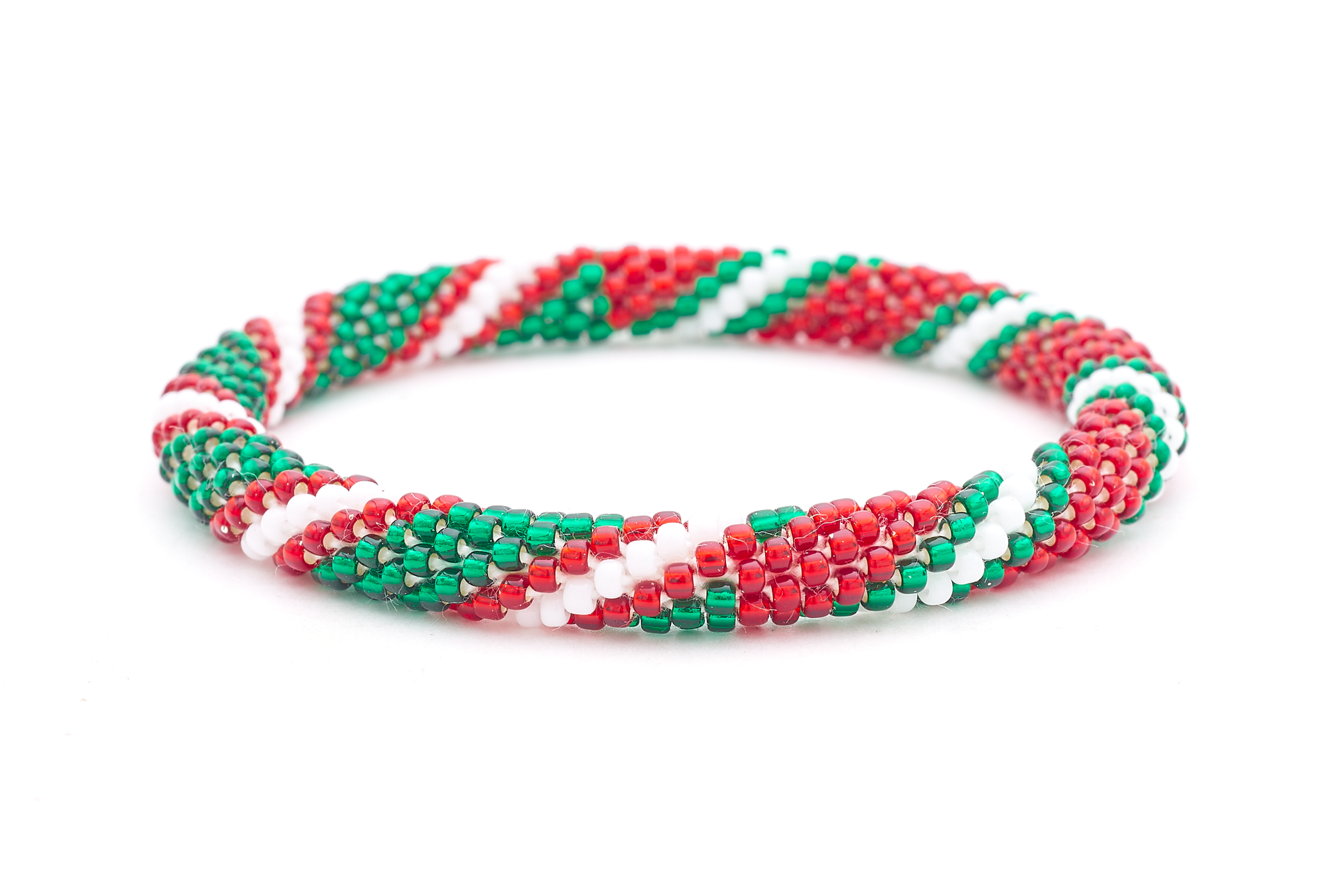 Sashka Co. handmade glass beaded friendship bracelet with red, white, and green glass beads in a festive holiday pattern. Crafted in Nepal by skilled artisans.
