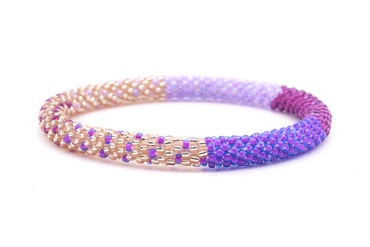 Sashka Co handmade beaded friendship bracelet with rose gold, purple, light purple, and magenta glass beads. Crafted in Nepal by skilled artisans.