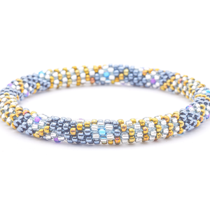 Sashka Co. handmade glass beaded friendship bracelet with silver, iridescent gold, clear, purple, and blue glass beads. Crafted in Nepal by skilled artisans.