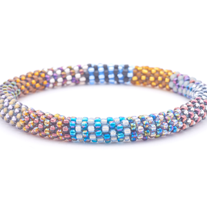 Sashka Co. handmade glass beaded friendship bracelet with silver, iridescent, plum, beige, purple, matte brown, bronze, matte black, light blue, and teal glass beads. Crafted in Nepal by skilled artisans.