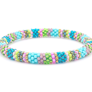 Sashka Co. handmade glass beaded friendship bracelet with teal, green, turquoise, pink, silver, purple, iridescent, and bronze glass beads. Crafted in Nepal by skilled artisans.