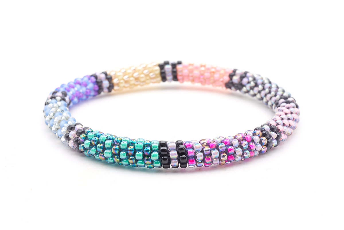 Handmade beaded friendship bracelet with teal, purple, yellow, coral, silver, black, and iridescent glass beads. Crafted by artisans in Nepal for Sashka Co.