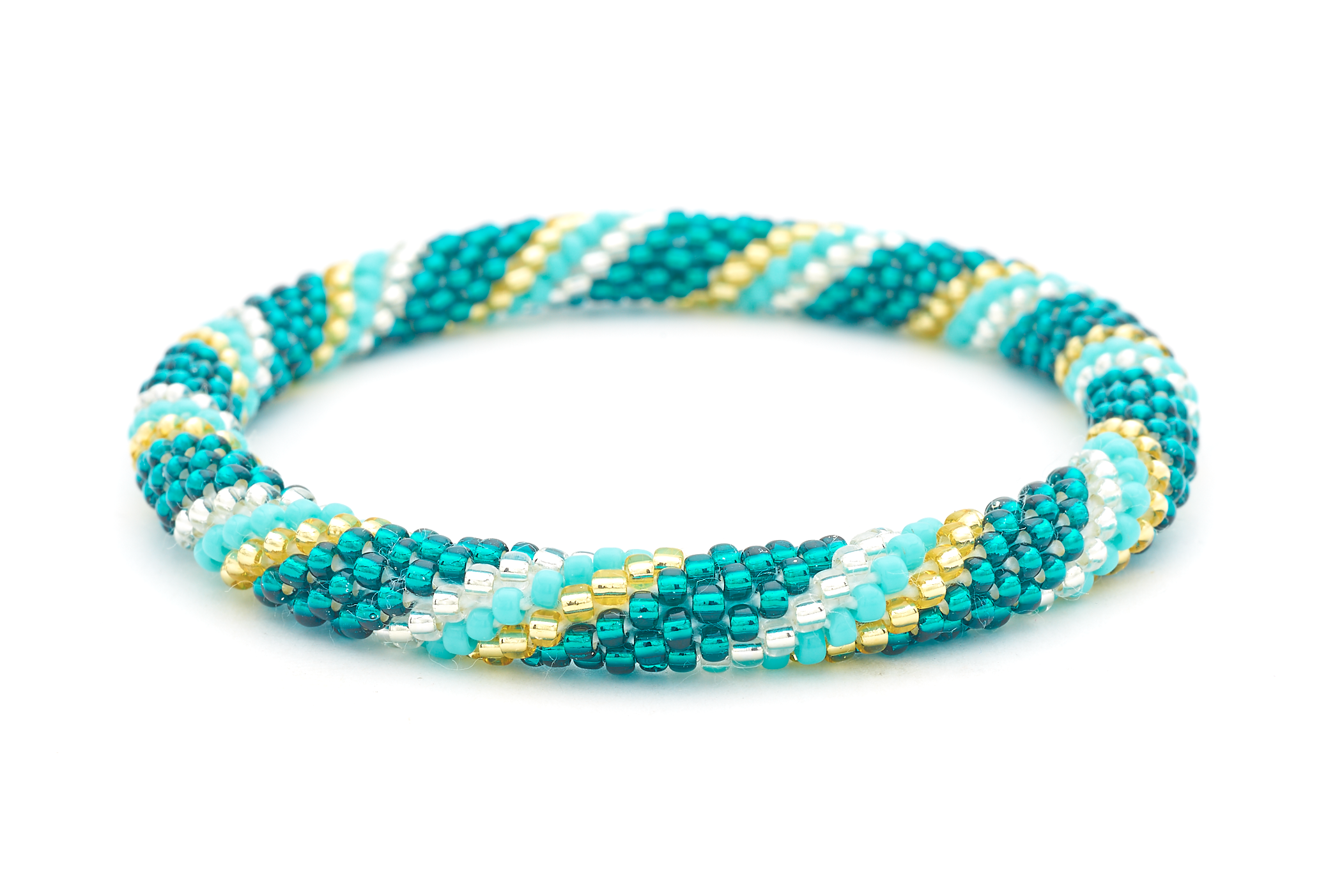 Sashka Co. handmade glass beaded friendship bracelet with teal, turquoise, champagne gold, and clear glass beads in a spiral pattern. Crafted in Nepal by skilled artisans.