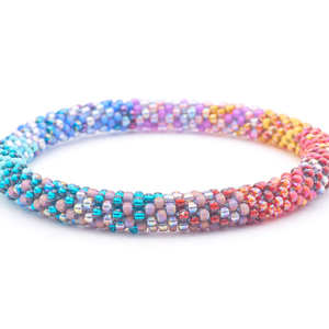Sashka Co. handmade glass beaded friendship bracelet with teal, turquoise, matte purple, matte pink, matte yellow, orange, matte red, red, iridescent silver, and matte mauve glass beads in a confetti mixed pattern. Crafted in Nepal by skilled artisans.
