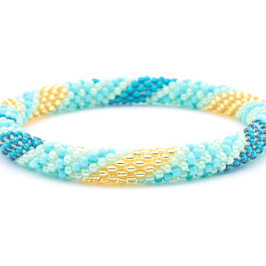 Sashka Co. handmade glass beaded friendship bracelet with turquoise, teal, mint, and champagne gold glass beads. Crafted in Nepal by skilled artisans.