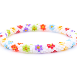 Sashka Co. handmade glass beaded friendship bracelet with white, baby blue, light green, yellow, red, orange, and gold glass beads. Crafted in Nepal by skilled artisans.