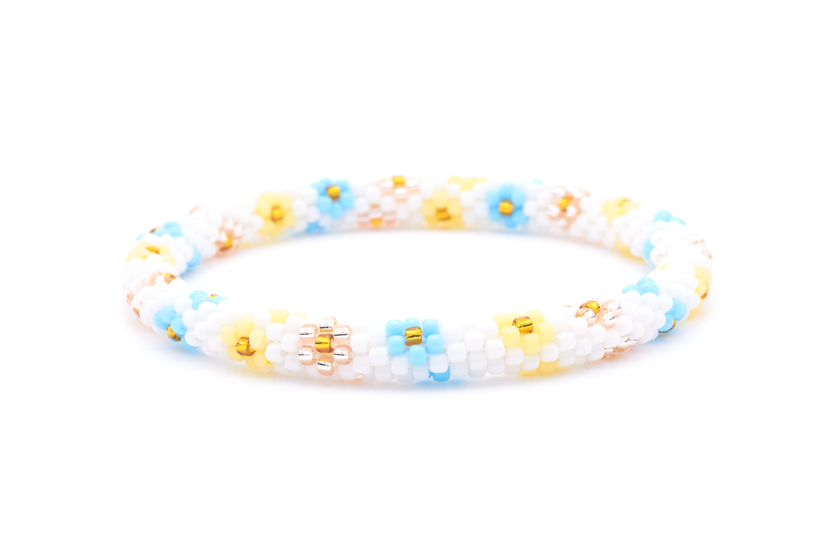 Sashka Co. handmade glass beaded friendship bracelet with white, baby blue, matte light yellow, rose gold, and gold glass beads. Crafted in Nepal by skilled artisans.