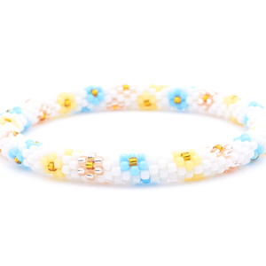 Sashka Co. handmade glass beaded friendship bracelet with white, baby blue, matte light yellow, rose gold, and gold glass beads. Crafted in Nepal by skilled artisans.