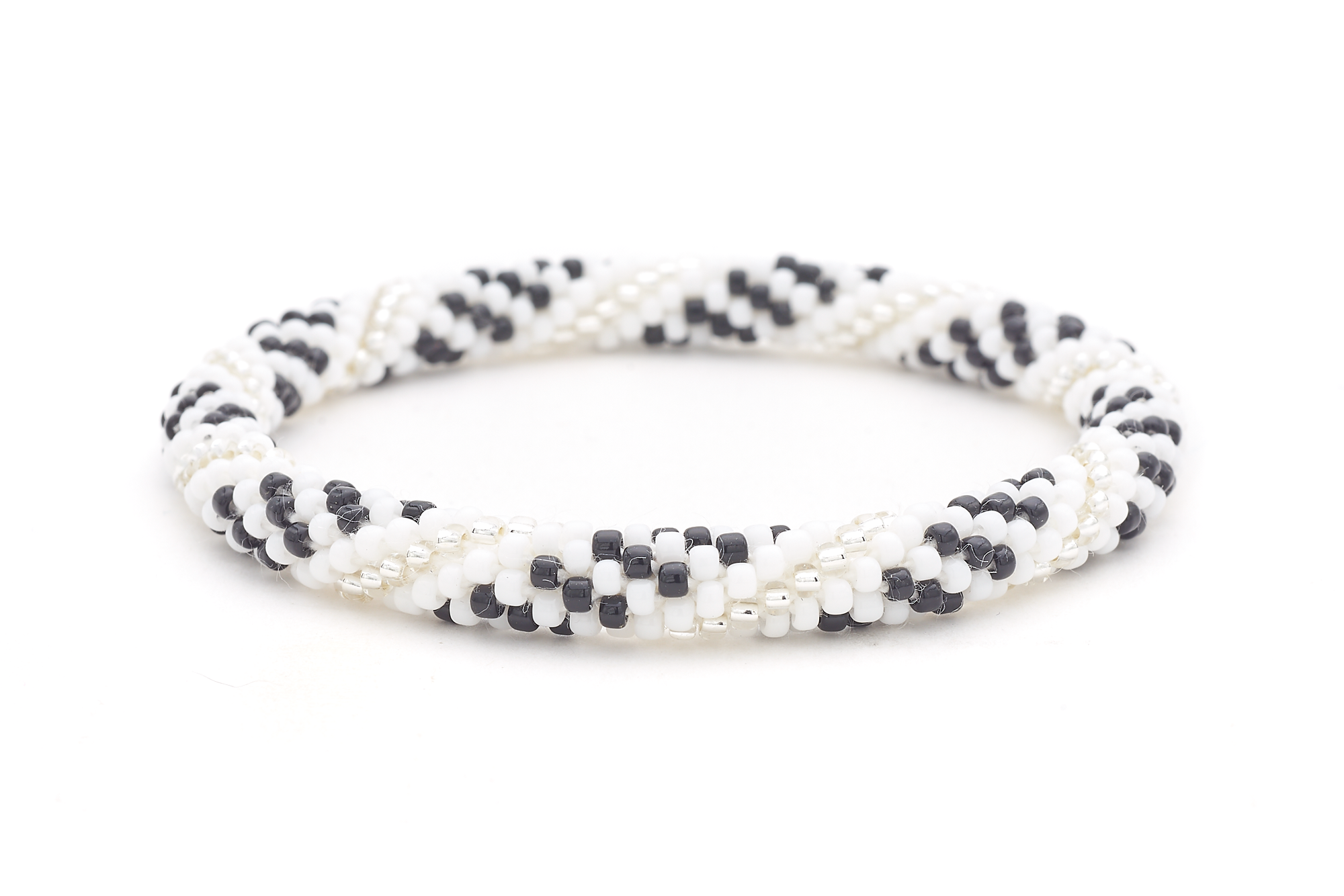 Handmade beaded friendship bracelet with white, black, and clear glass beads. Crafted by artisans in Nepal for Sashka Co.