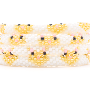 Sashka Co. handmade glass beaded friendship bracelet with white, black, pink, and yellow glass beads. Crafted in Nepal by skilled artisans.