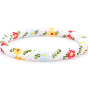 Sashka Co. handmade glass beaded friendship bracelet with white, green, red, blue, and orangish yellow glass beads. Crafted in Nepal by skilled artisans.