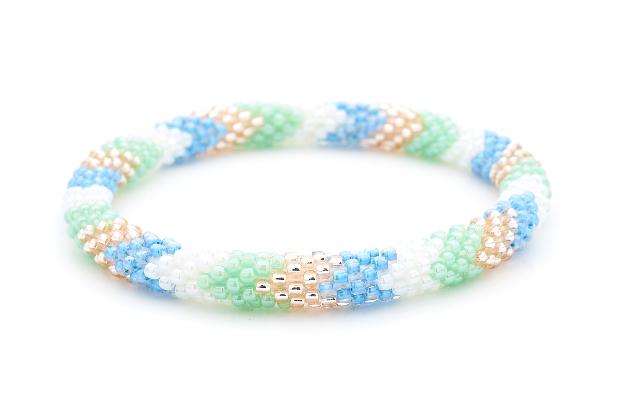 Sashka Co. handmade glass beaded friendship bracelet with white, mint, blue, and rose gold glass beads in a chevron pattern. Crafted in Nepal by skilled artisans.