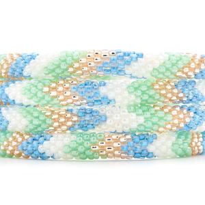 Sashka Co. handmade glass beaded friendship bracelet with white, mint, blue, and rose gold glass beads in a chevron pattern. Crafted in Nepal by skilled artisans.