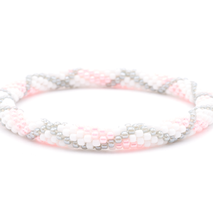 Sashka Co. handmade glass beaded friendship bracelet with white, pink, and gray glass beads. Crafted in Nepal by skilled artisans.