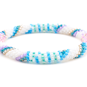 Sashka Co handmade beaded friendship bracelet with white, pink, purple, blue, rose gold, and teal glass beads. Crafted in Nepal by skilled artisans.
