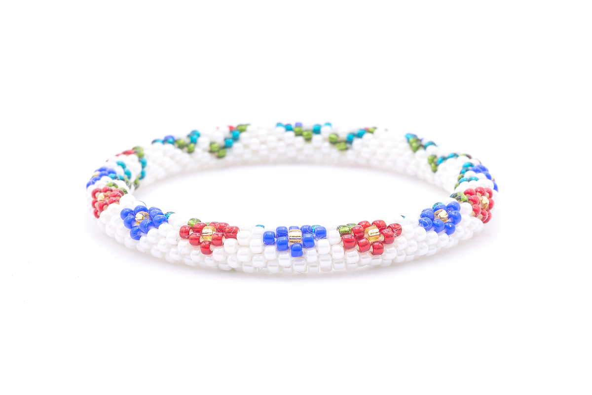 Sashka Co. handmade glass beaded friendship bracelet with white, red, blue, green, teal, and champagne gold glass beads. Crafted in Nepal by skilled artisans.
