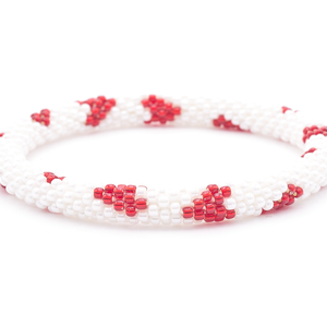 Sashka Co. handmade glass beaded friendship bracelet with white and red glass beads in a hearts pattern. Crafted in Nepal by skilled artisans.
