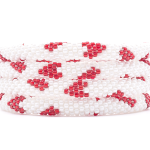 Sashka Co. handmade glass beaded friendship bracelet with white and red glass beads in a hearts pattern. Crafted in Nepal by skilled artisans.