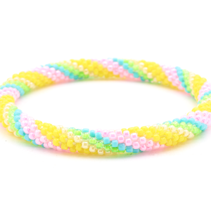 Handmade beaded friendship bracelet with yellow, pink, turquoise, green, and cream glass beads. Crafted by artisans in Nepal for Sashka Co.