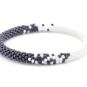 Sashka Co handmade beaded friendship bracelet with black and white glass beads. Crafted in Nepal by skilled artisans in a half-and-half blend pattern.
