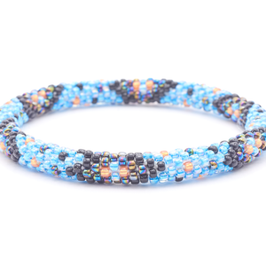Sashka Co. handmade beaded friendship bracelet with blue, black, orange, and iridescent chevron polka dot pattern. Crafted in Nepal by skilled artisans.