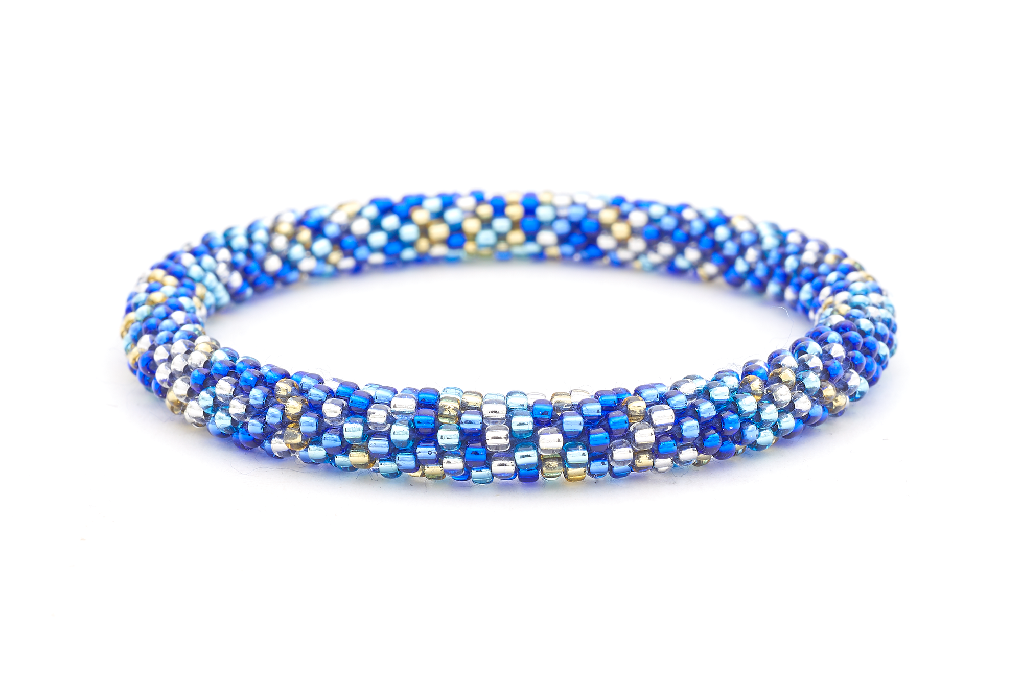 Sashka Co handmade beaded friendship bracelet with blue, champagne gold, clear, and confetti glass beads. Crafted in Nepal by skilled artisans in a unique radiant pattern.

