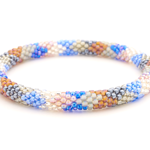Sashka Co handmade beaded friendship bracelet with blue, silver, clear, brown, gray, and mauve glass beads. Crafted in Nepal by skilled artisans.