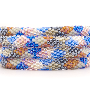 Sashka Co handmade beaded friendship bracelet with blue, silver, clear, brown, gray, and mauve glass beads. Crafted in Nepal by skilled artisans.