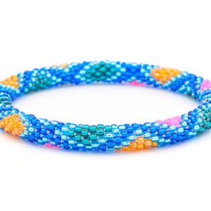Sashka Co handmade beaded friendship bracelet with blue, teal, neon pink, and orange glass beads. Crafted in Nepal by skilled artisans in a diamond pattern.