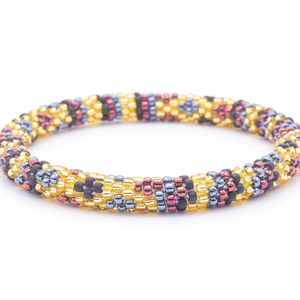 Sashka Co. handmade beaded friendship bracelet with champagne gold, matte black, silver, and iridescent maroon diamond line pattern. Crafted in Nepal by skilled artisans.