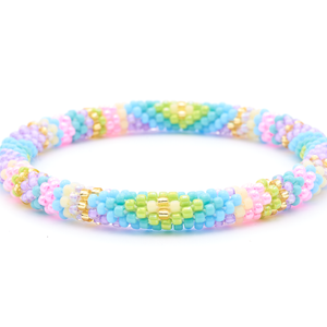 Sashka Co. handmade beaded friendship bracelet with champagne gold, matte yellow, green, turquoise, blue, purple, and pink diamond line pattern. Crafted in Nepal by skilled artisans.