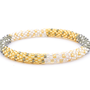 Sashka Co handmade beaded friendship bracelet with champagne gold, silver, and clear glass beads. Crafted in Nepal by skilled artisans in a block polka dot pattern.