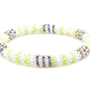 Sashka Co handmade beaded friendship bracelet with clear, green, mint, iridescent clear, and iridescent mix glass beads. Crafted in Nepal by skilled artisans in a line pattern.

