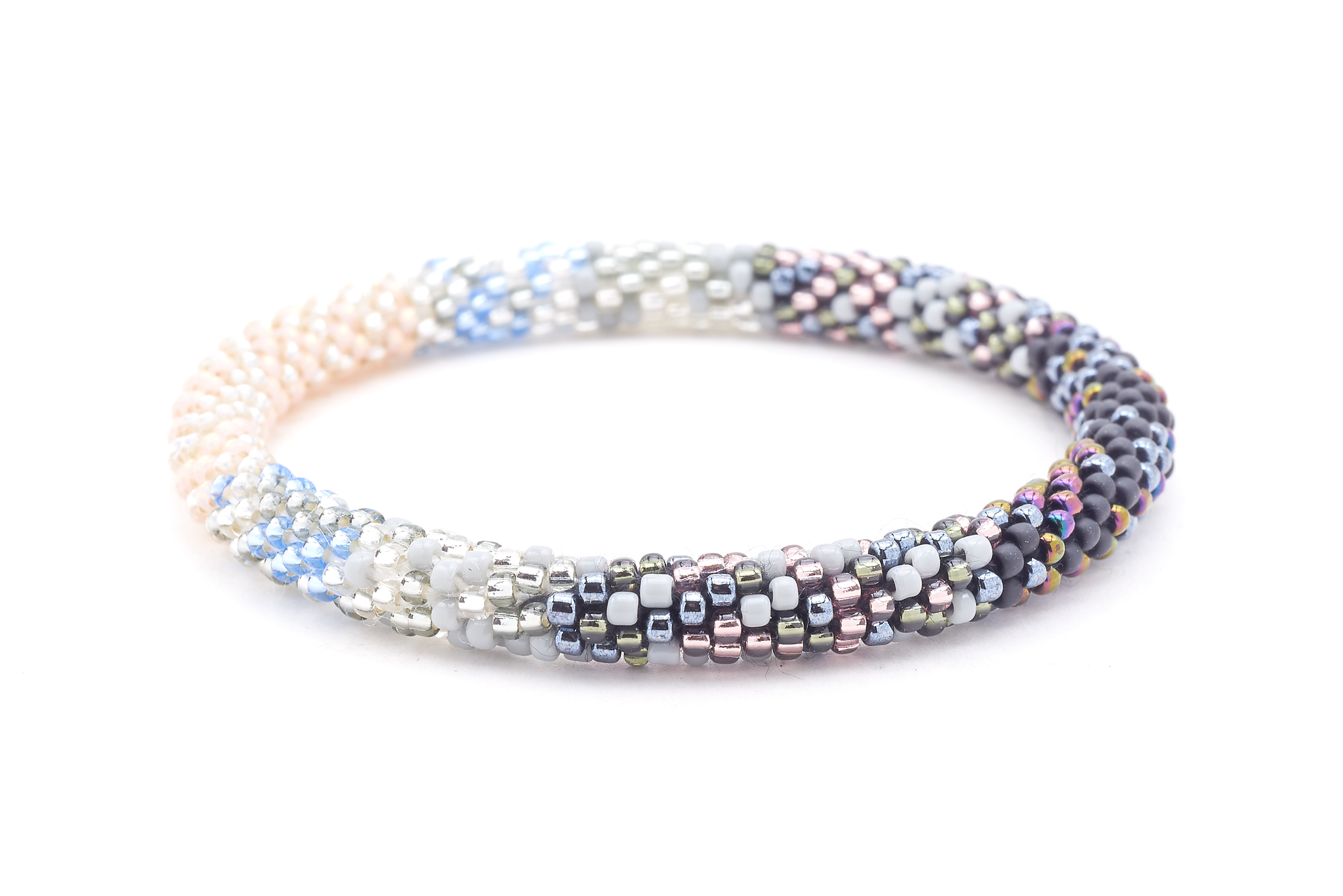 Sashka Co handmade beaded friendship bracelet with clear, silver, light peach, matte black, iridescent, gray, and light blue glass beads. Crafted in Nepal by skilled artisans in a confetti blend pattern.