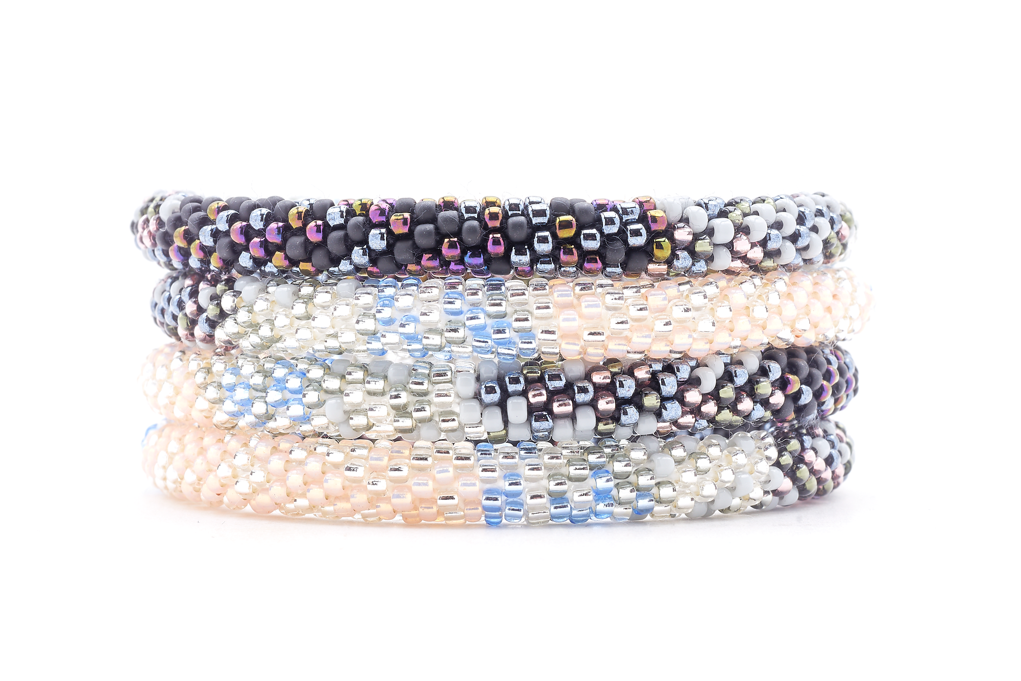 Sashka Co handmade beaded friendship bracelet with clear, silver, light peach, matte black, iridescent, gray, and light blue glass beads. Crafted in Nepal by skilled artisans in a confetti blend pattern.