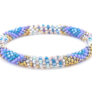 Sashka Co handmade beaded friendship bracelet with clear, teal, matte iridescent blue, iridescent bronze, mint, and iridescent mauve glass beads. Crafted in Nepal by skilled artisans in a diamond line pattern.