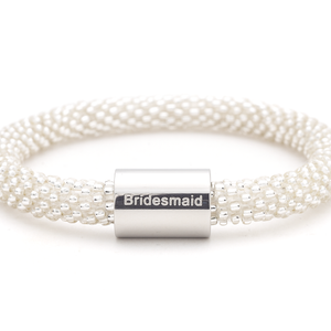 Sashka Co. Clear w/ Silver Bridesmaid Charm Bracelet. Handmade glass bead bracelet from Nepal, featuring a roll design.
 
