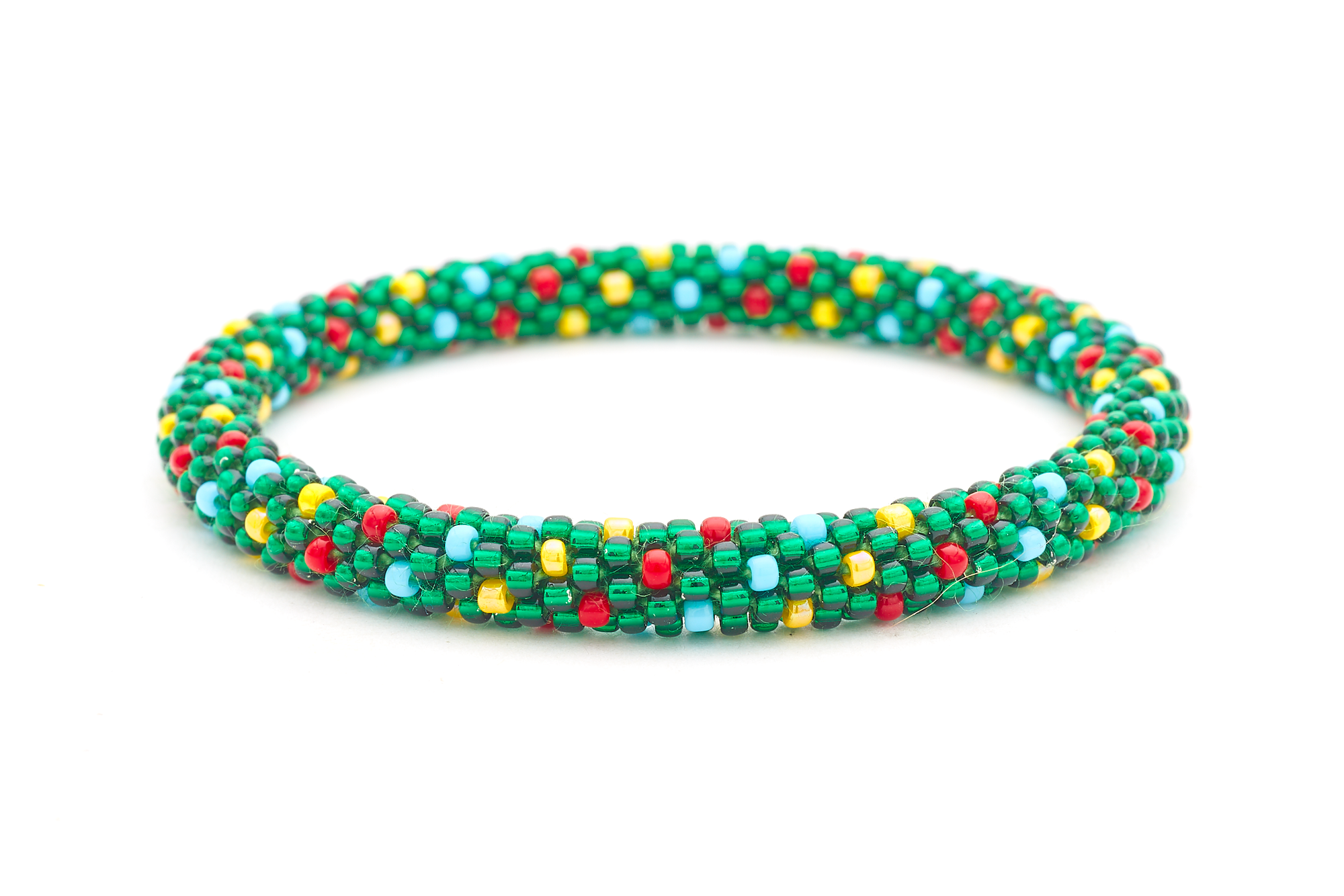 Sashka Co handmade beaded friendship bracelet with green, red, yellow, and blue glass beads. Crafted in Nepal by skilled artisans in a spiral polka dot pattern.