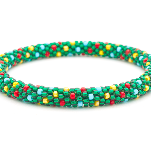 Sashka Co handmade beaded friendship bracelet with green, red, yellow, and blue glass beads. Crafted in Nepal by skilled artisans in a spiral polka dot pattern.