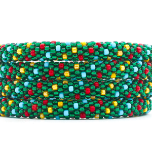 Sashka Co handmade beaded friendship bracelet with green, red, yellow, and blue glass beads. Crafted in Nepal by skilled artisans in a spiral polka dot pattern.