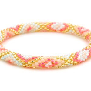 Sashka Co handmade beaded friendship bracelet with hot pink, gold, matte nude, and iridescent clear diamond pattern. Crafted in Nepal.

