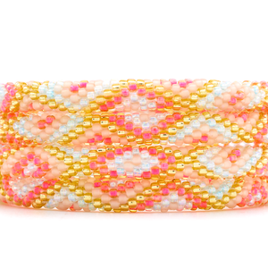 Sashka Co handmade beaded friendship bracelet with hot pink, gold, matte nude, and iridescent clear diamond pattern. Crafted in Nepal.

