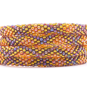 Sashka Co. handmade beaded friendship bracelet with iridescent orange, gold, and iridescent diamond pattern. Crafted in Nepal by skilled artisans.